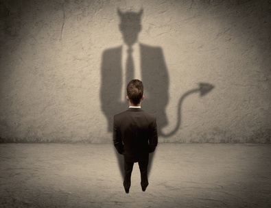 Salesman facing his own devil shadow
